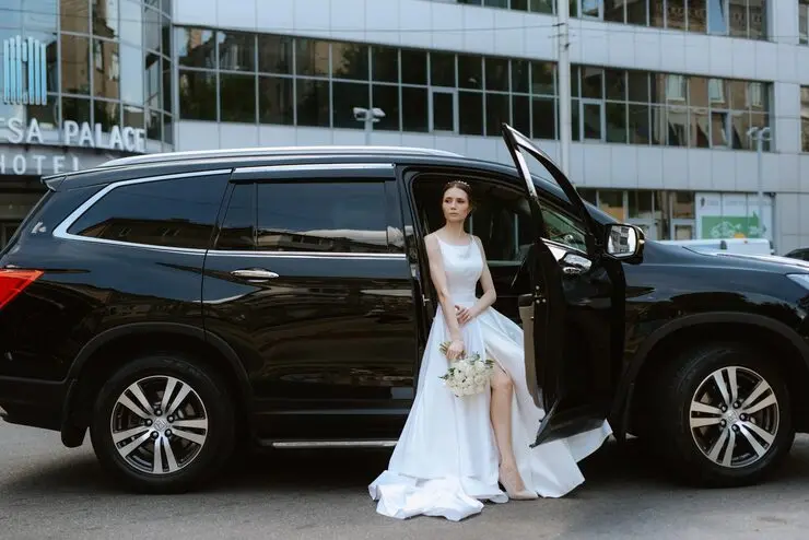 Luxury wedding car hire in Auckland — bridal party arriving in NZ Limo & Tours vehicle